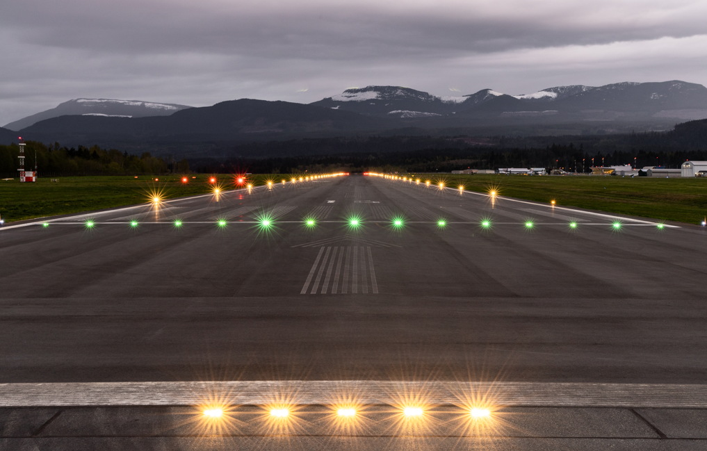 Screenshot 2024-10-23 125558 two electric vehicle chargers with the electric vehicle logo painted on the pavement
