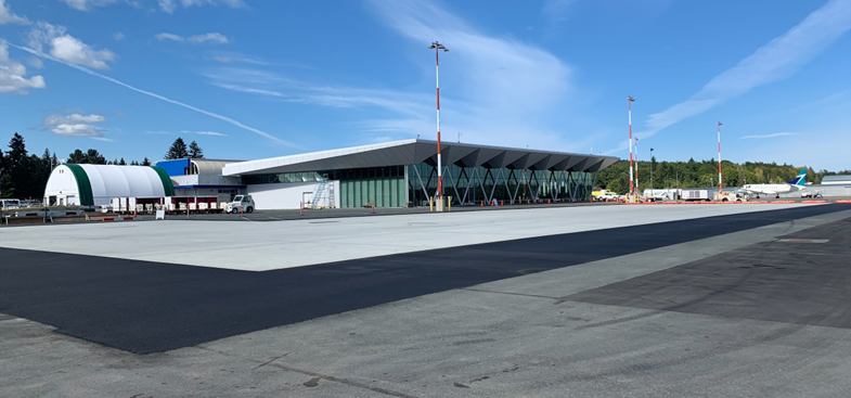 concrete filling Polinator garden sign in the middle of the garden surrounded by green plants