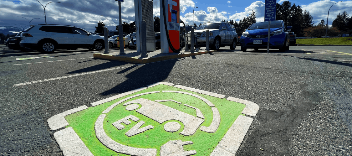 EV Charging Station Electric vehicle charging station on a sunny day.